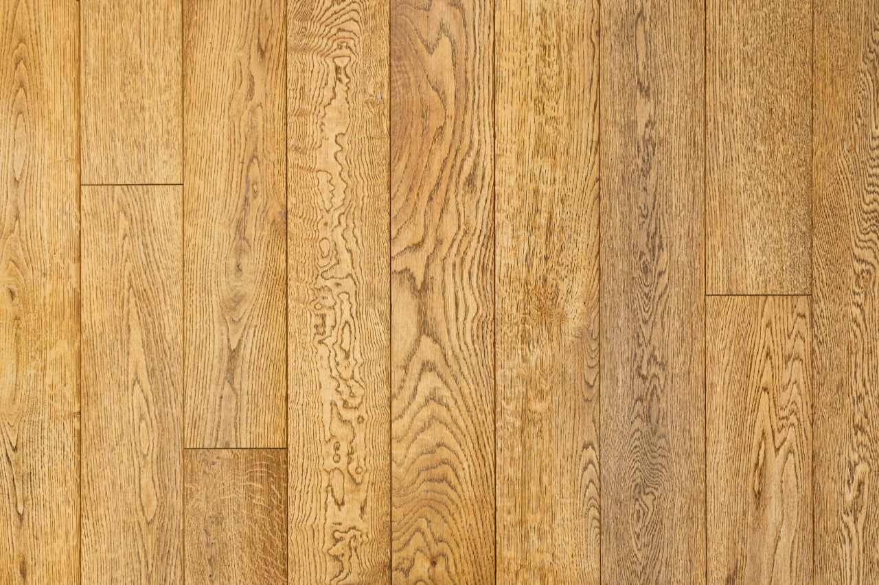 Close view of oak floorboards showing the grain.